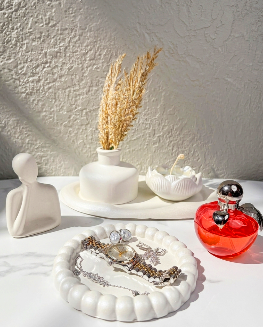Pearly RocioTreasure plaster decor set with tray, abstract figure, vase, and lotus candle.